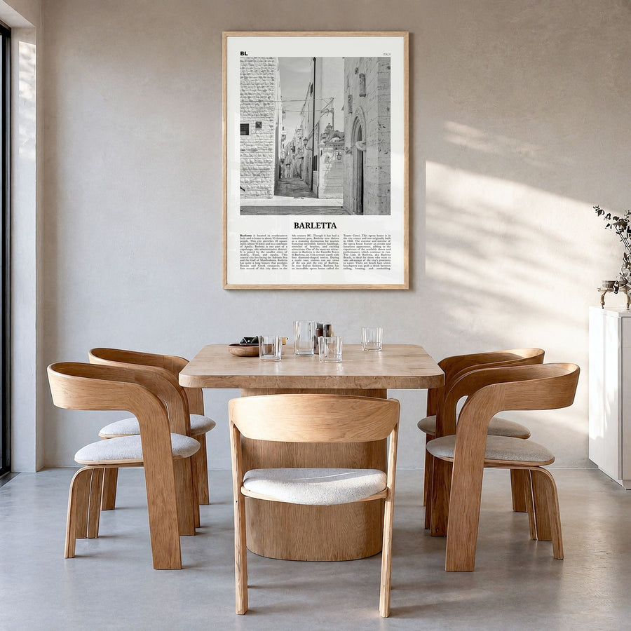 Barletta Newspaper Poster in a natural wood frame, hanging in a dining room