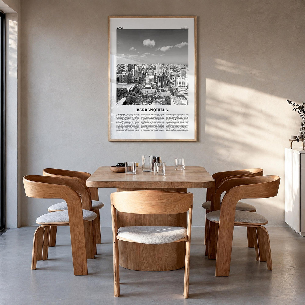 Barranquilla black & white newspaper poster of Colombia – vertical wall art in natural wood frame, hanging on wall