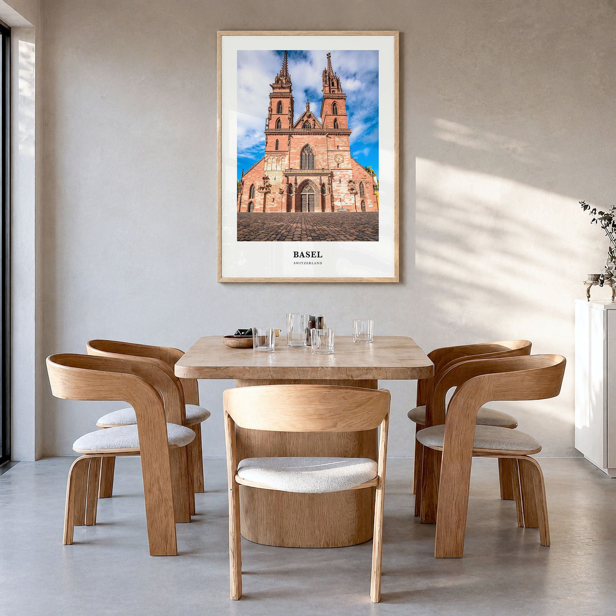 Basel Classic Poster in a natural wood frame, hanging in a dining room