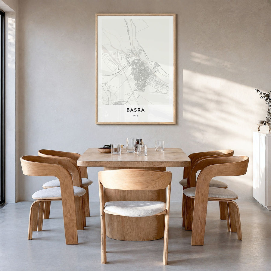 Basra Map Poster in a natural wood frame, hanging in a dining room
