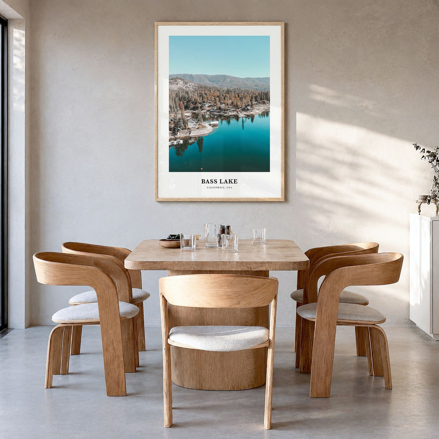 Bass Lake Classic Poster in a natural wood frame, hanging in a dining room