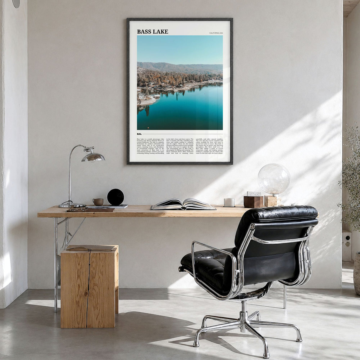 Bass Lake Travel Poster in a black wood frame, hanging in a bright home office