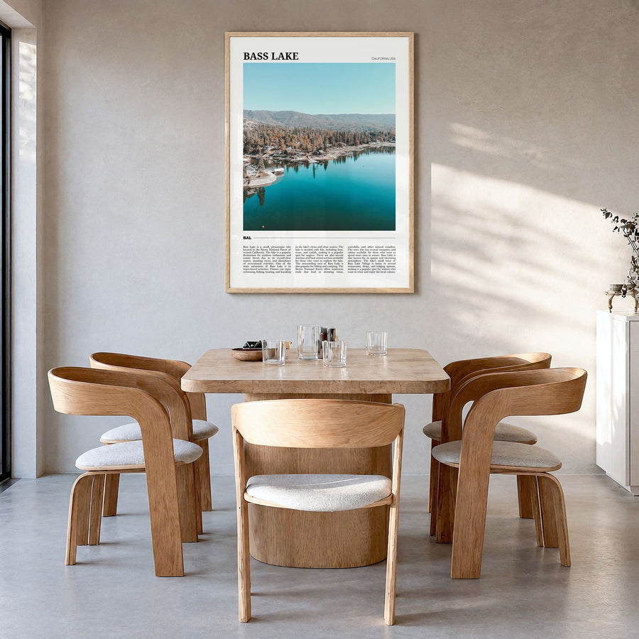 Bass Lake Travel Poster in a natural wood frame, hanging in a dining room