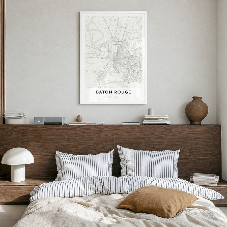 Baton Rouge Map Poster in a white wood frame, hanging in a bedroom