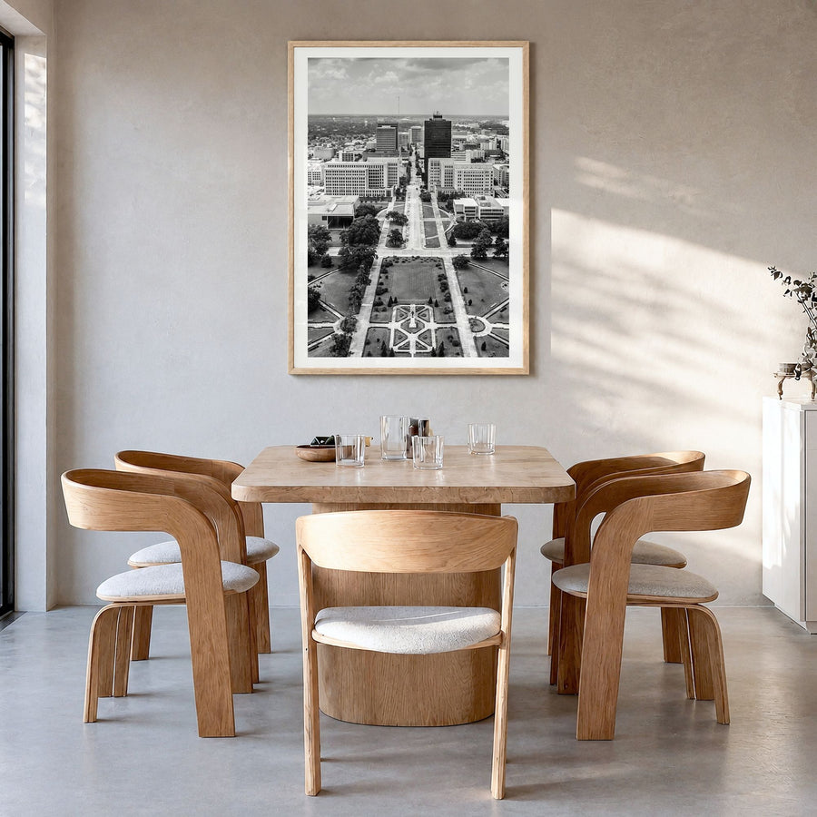 Baton Rouge Photo Poster in a natural wood frame, hanging in a dining room, white border