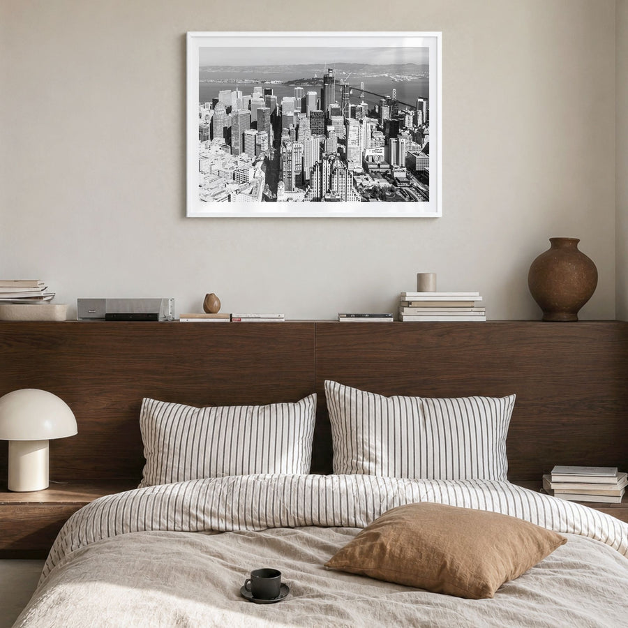 Bay Area Photo Poster in a white wood frame, hanging in a bedroom, white border