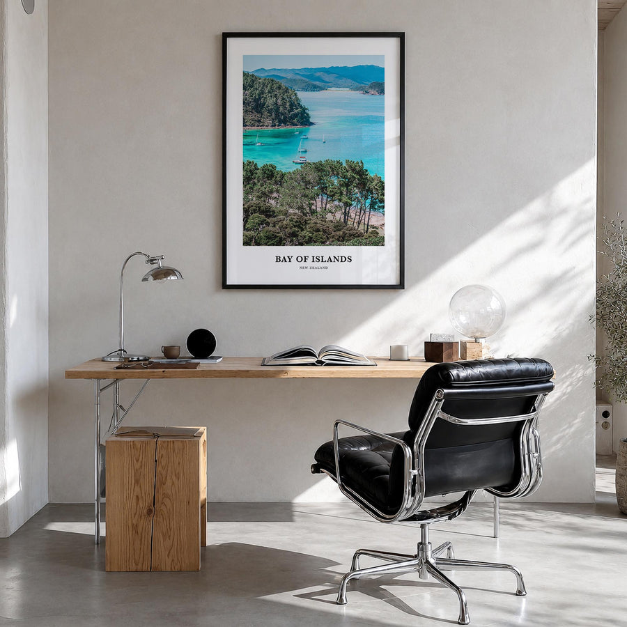 Bay of Islands colorful classic poster of New Zealand – vertical wall art in black wood frame, hanging on wall