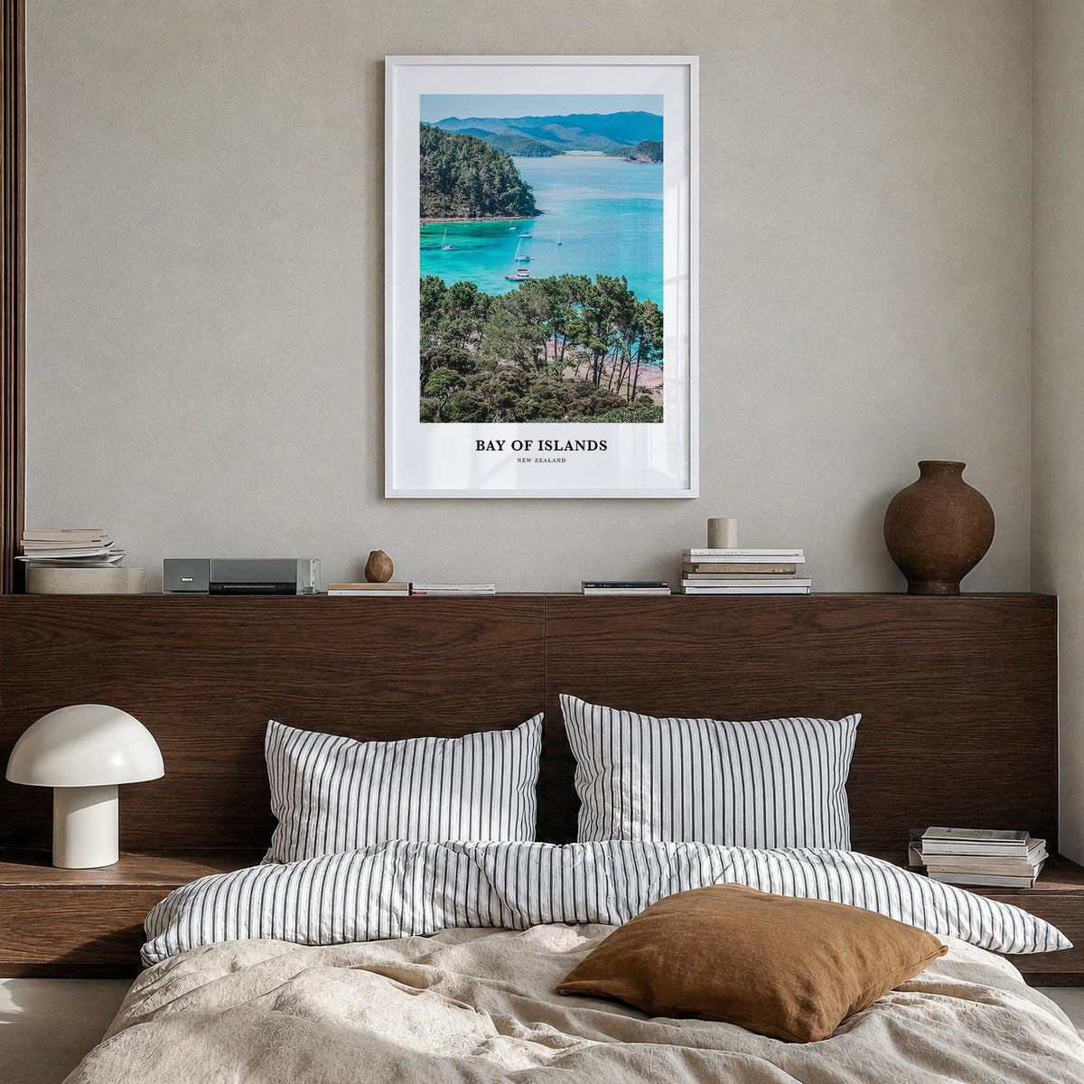 Bay of Islands colorful classic poster of New Zealand – vertical wall art in white wood frame, hanging on wall
