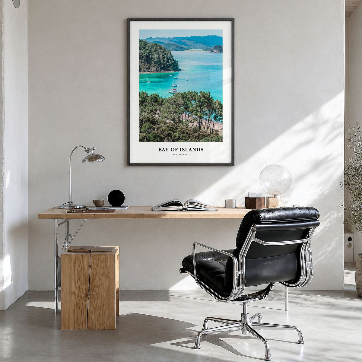 Bay of Islands Classic Poster in a black wood frame, hanging in a bright home office