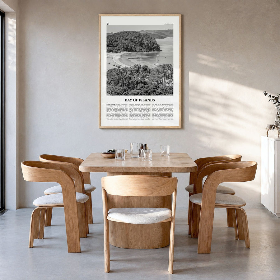 Bay of Islands Newspaper Poster in a natural wood frame, hanging in a dining room