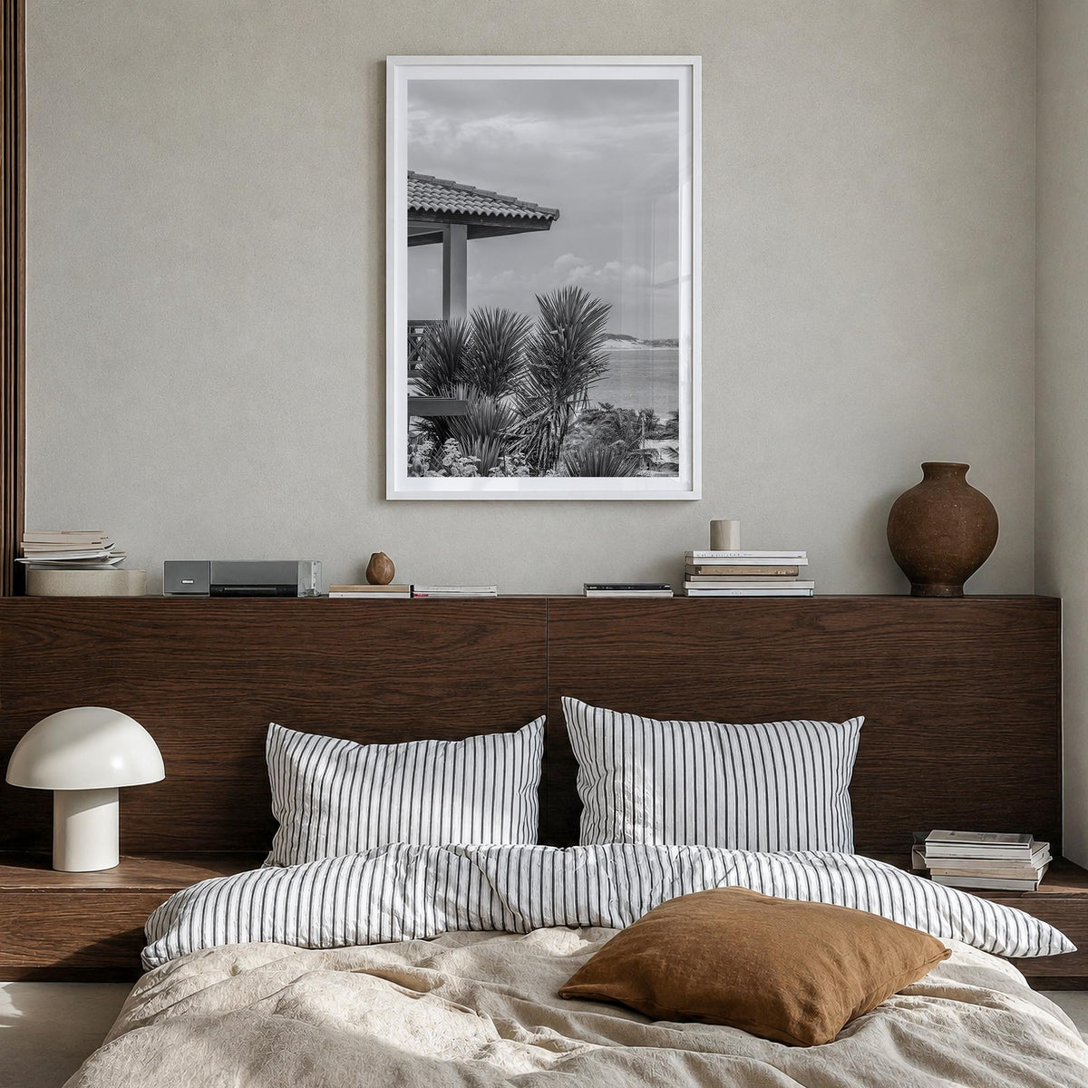 Beach House black & white photo poster – vertical wall art in white wood frame with white border, hanging on wall