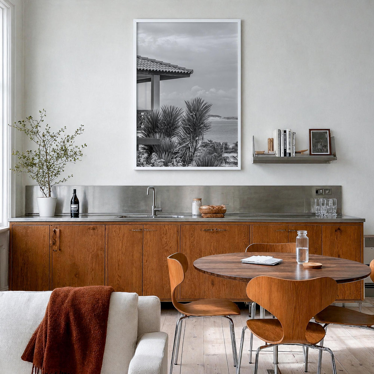 Beach House black & white photo poster – vertical wall art in white wood frame, hanging on wall
