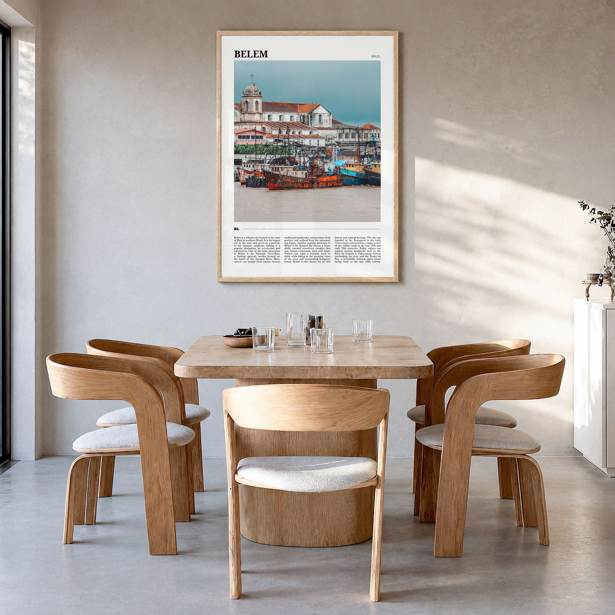 Belém Travel Poster in a natural wood frame, hanging in a dining room
