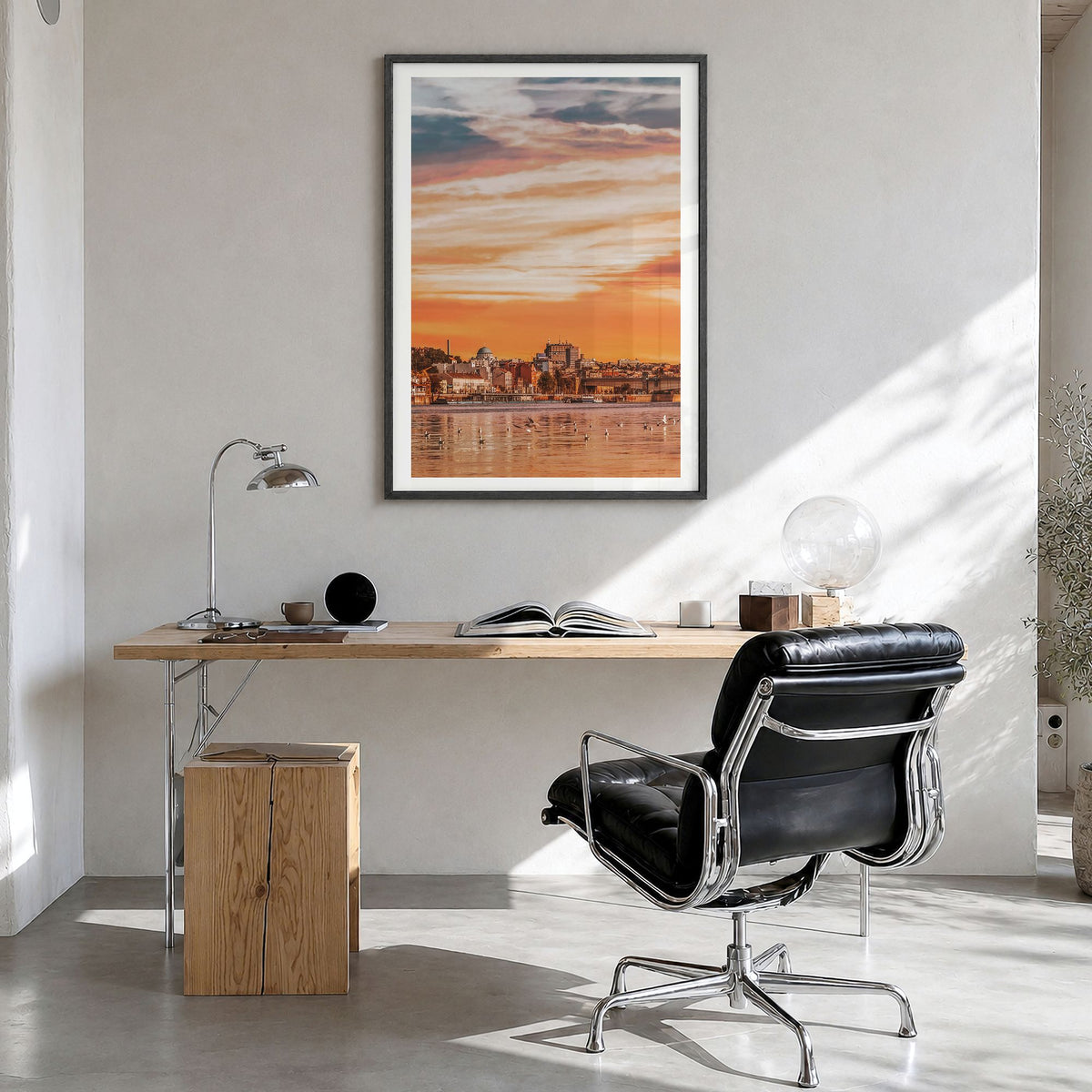 Belgrade Photo Poster in a black wood frame, hanging in a bright home office, white border