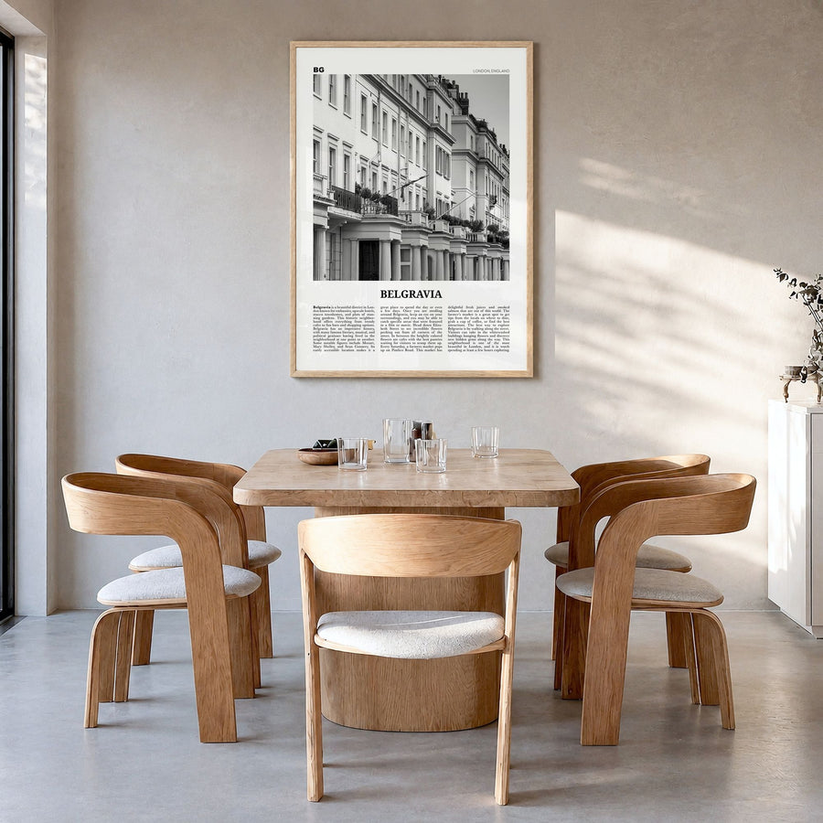 Belgravia Newspaper Poster in a natural wood frame, hanging in a dining room