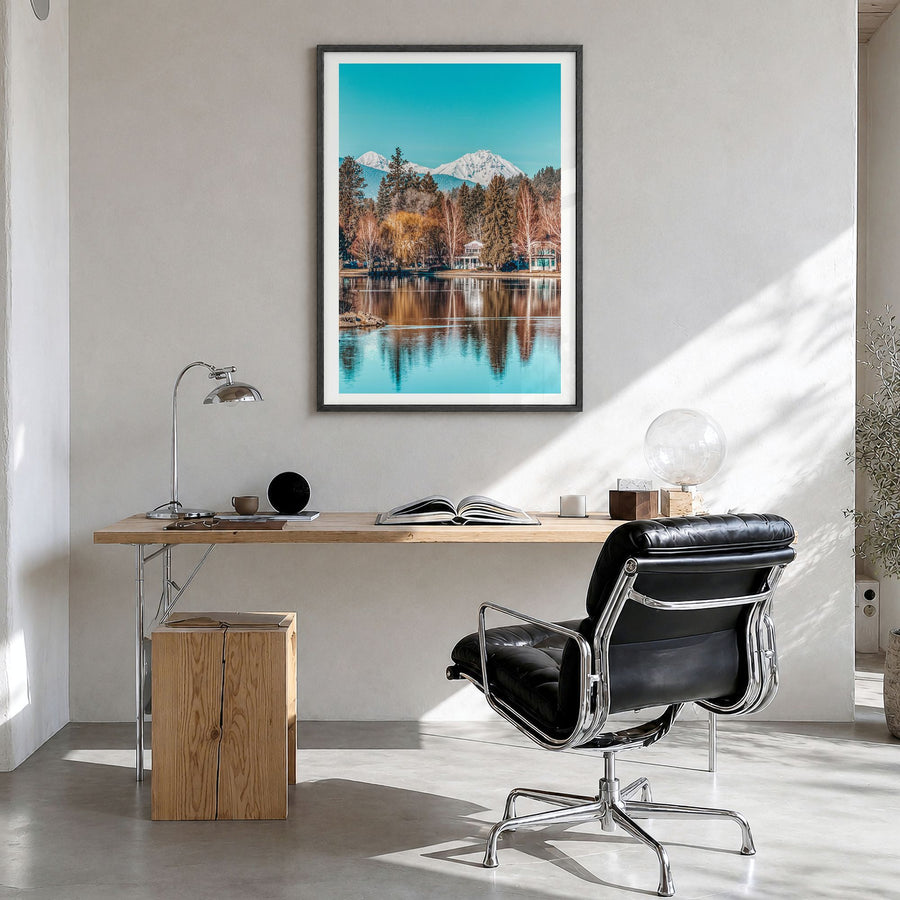 Bend Photo Poster in a black wood frame, hanging in a bright home office, white border