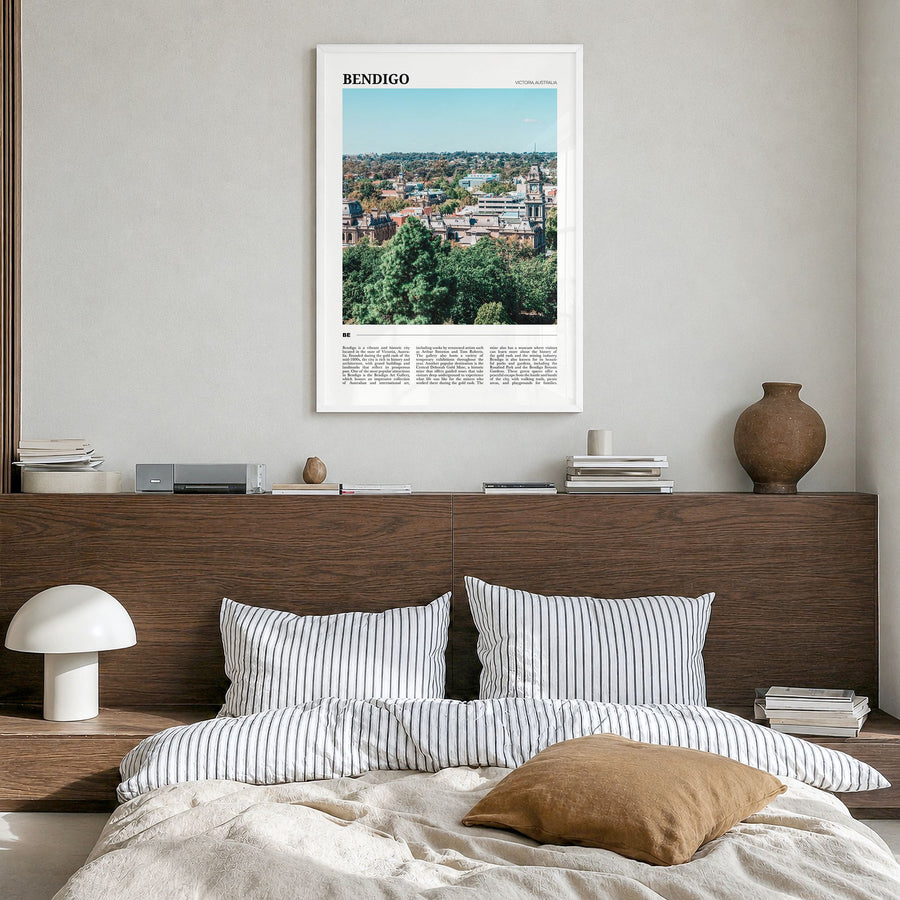 Bendigo Travel Poster in a white wood frame, hanging in a bedroom