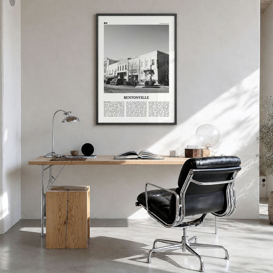 Bentonville Newspaper Poster in a black wood frame, hanging in a bright home office