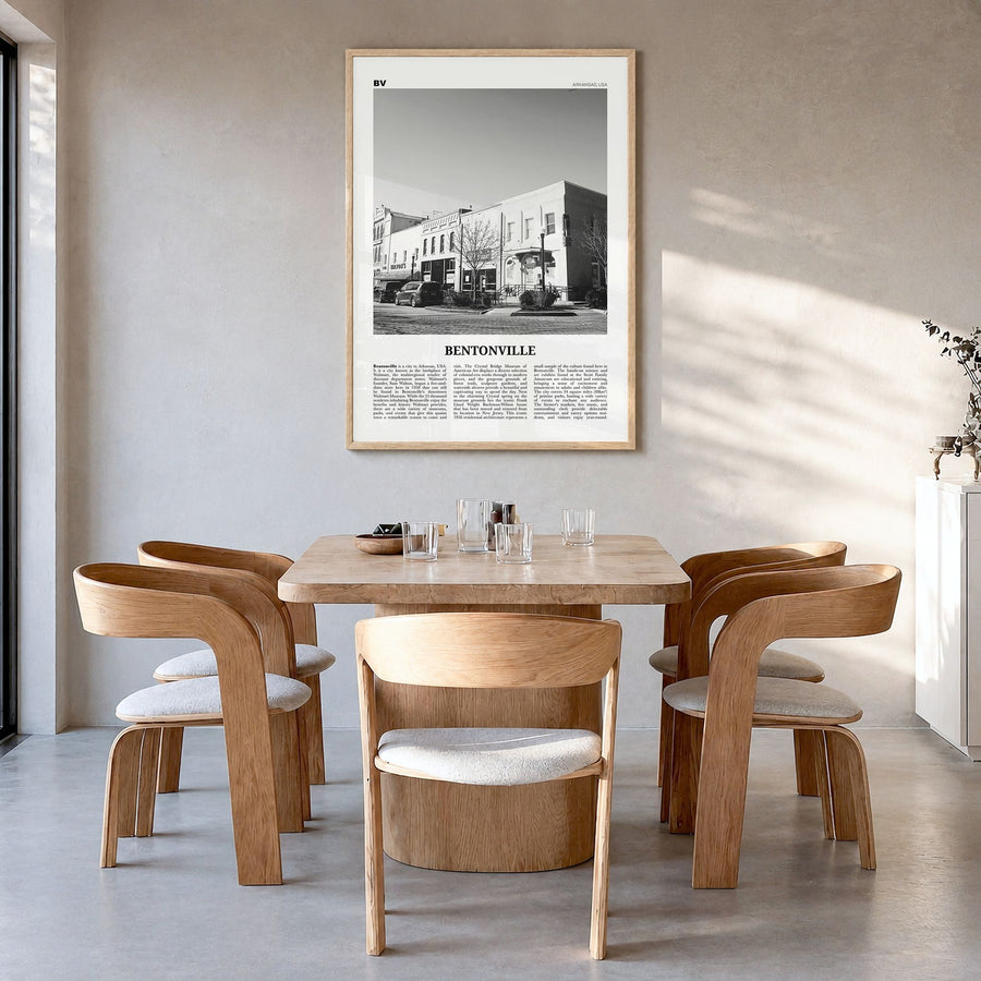 Bentonville Newspaper Poster in a natural wood frame, hanging in a dining room