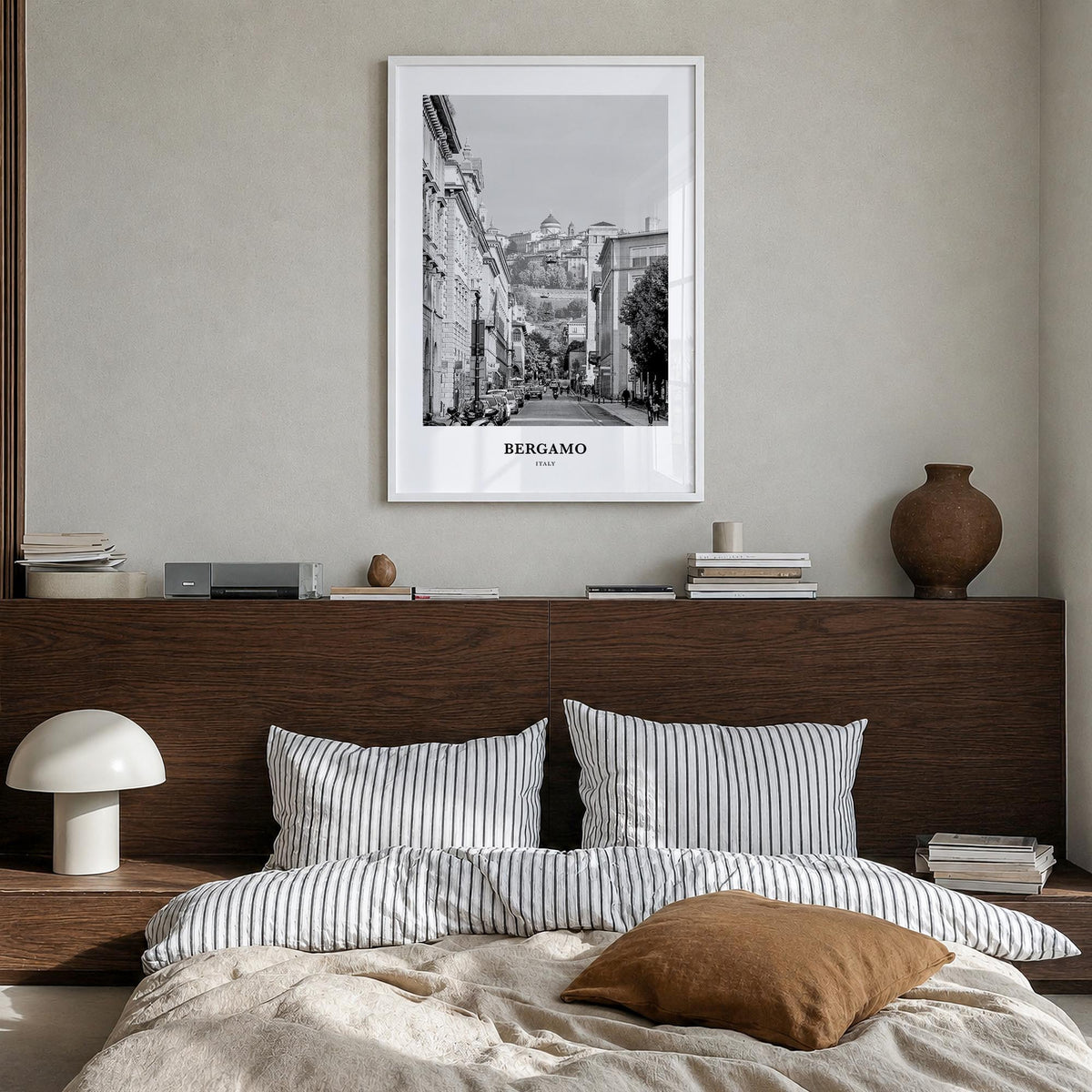 Bergamo black & white classic poster of Italy – vertical wall art in white wood frame, hanging on wall