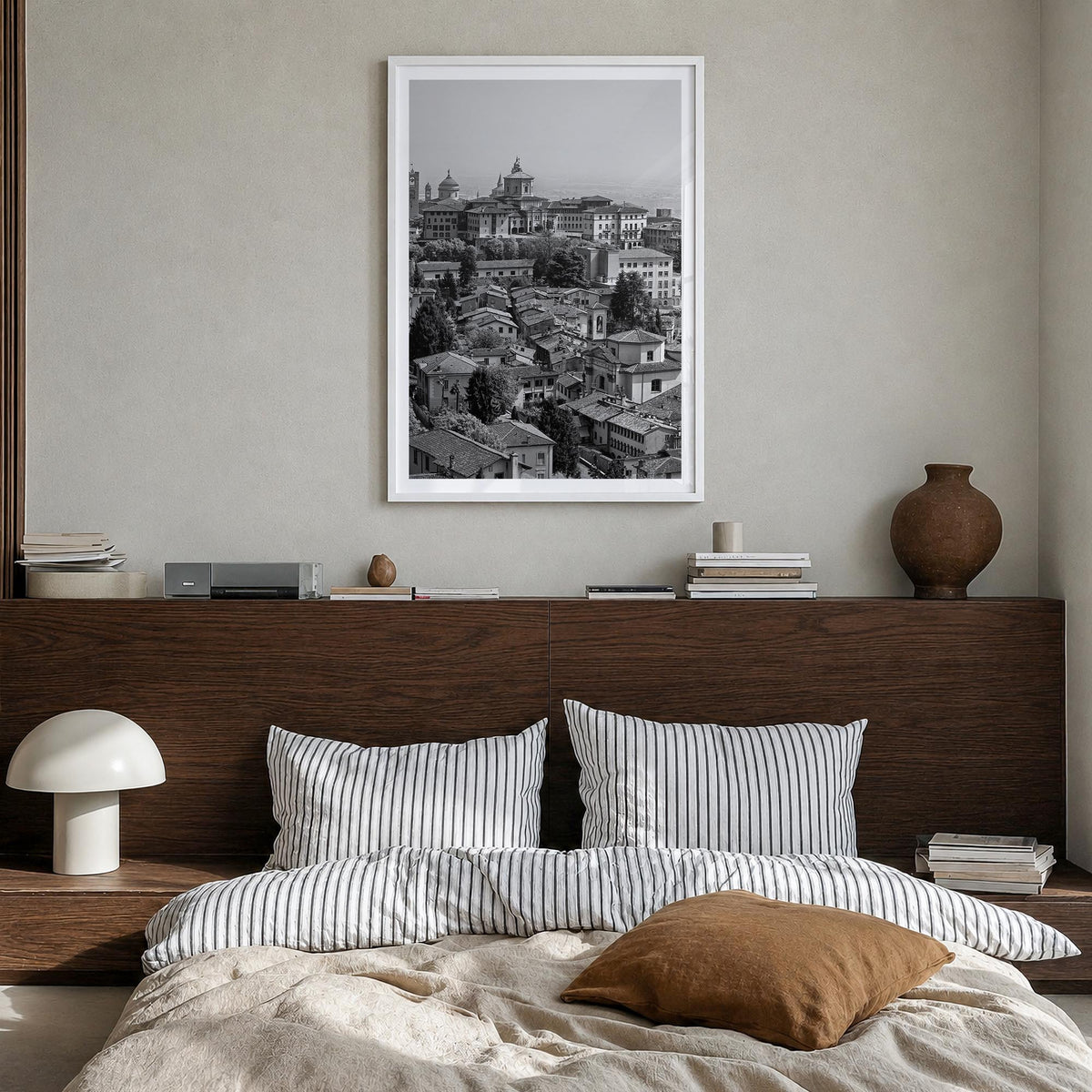 Bergamo black & white photo poster of Italy – vertical wall art in white wood frame with white border, hanging on wall