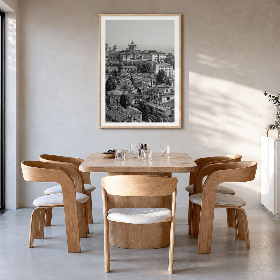 Bergamo Photo Poster in a natural wood frame, hanging in a dining room, white border