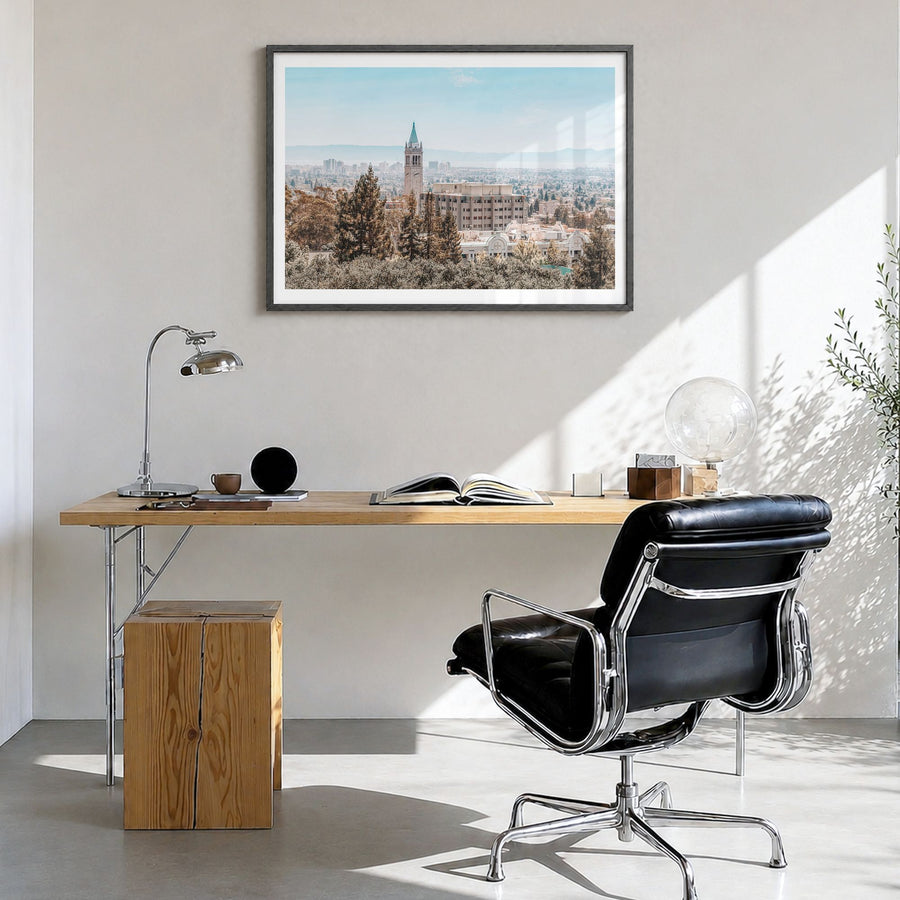 Berkeley Photo Poster in a black wood frame, hanging in a bright home office, white border