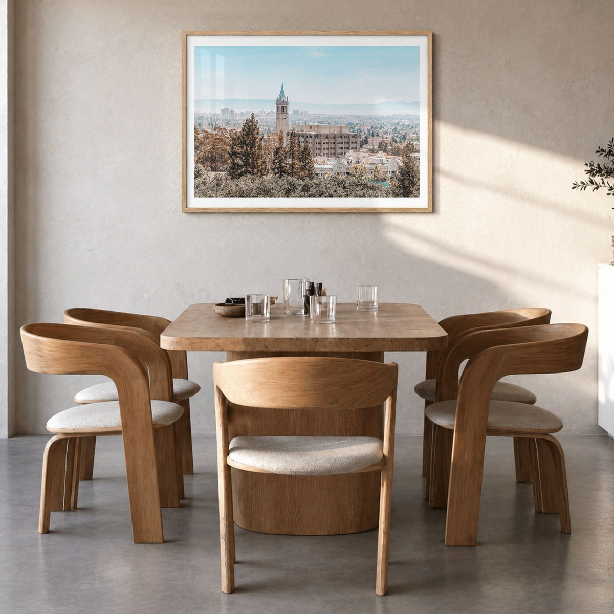Berkeley Photo Poster in a natural wood frame, hanging in a dining room, white border