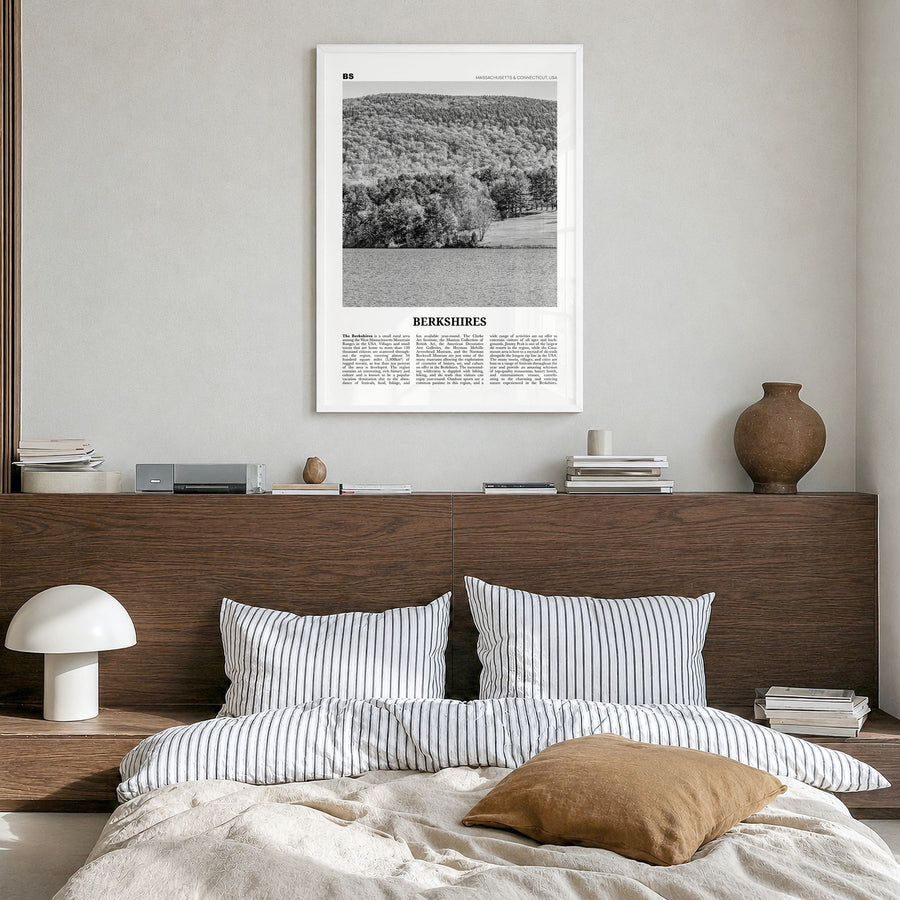 Berkshires Newspaper Poster in a white wood frame, hanging in a bedroom