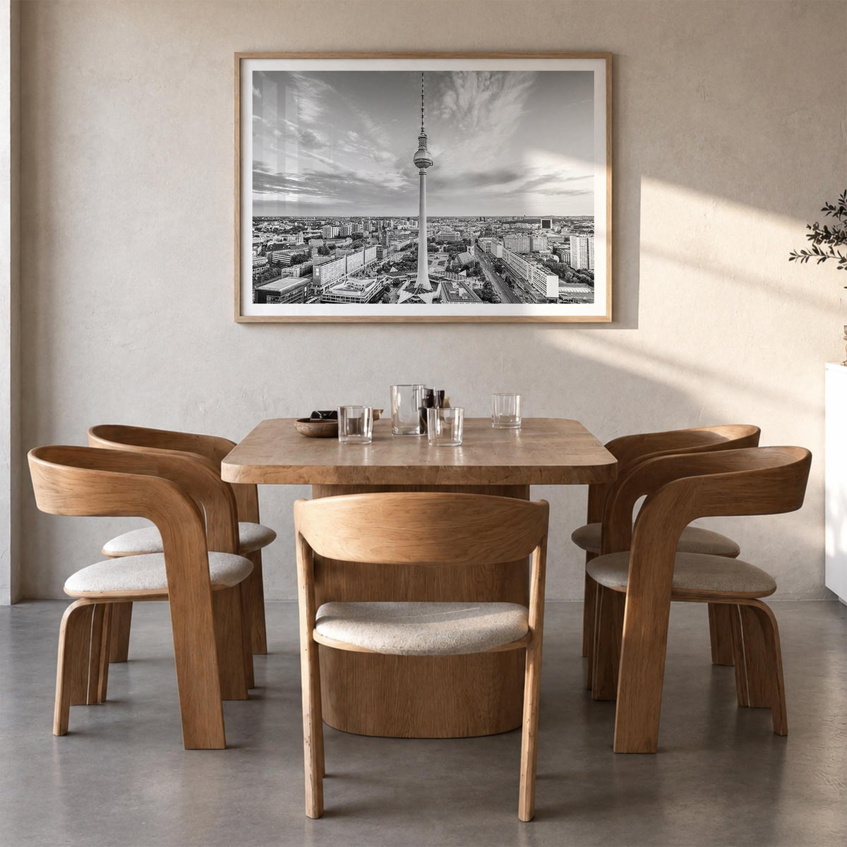 Berlin black & white photo poster of Germany – horizontal wall art in natural wood frame with white border, hanging on wall