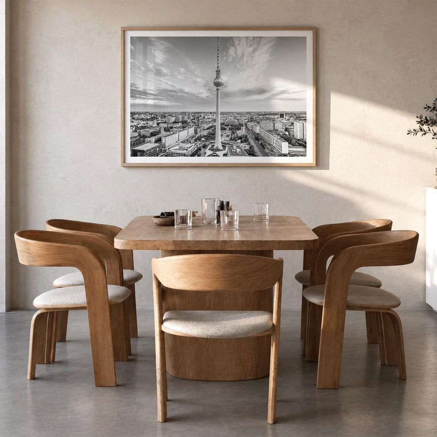 Berlin black & white photo poster of Germany – horizontal wall art in natural wood frame with white border, hanging on wall