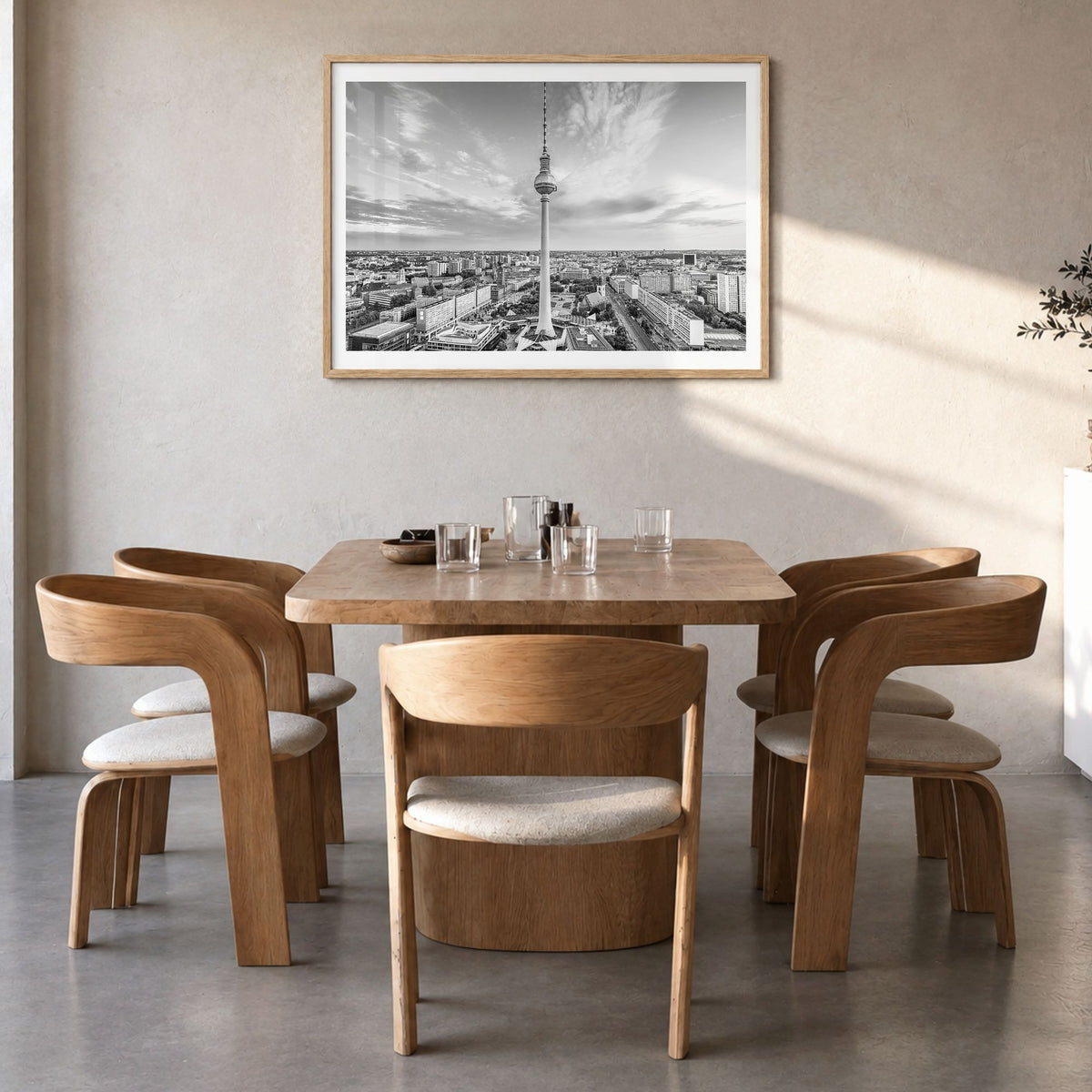 Berlin Photo Poster in a natural wood frame, hanging in a dining room, white border