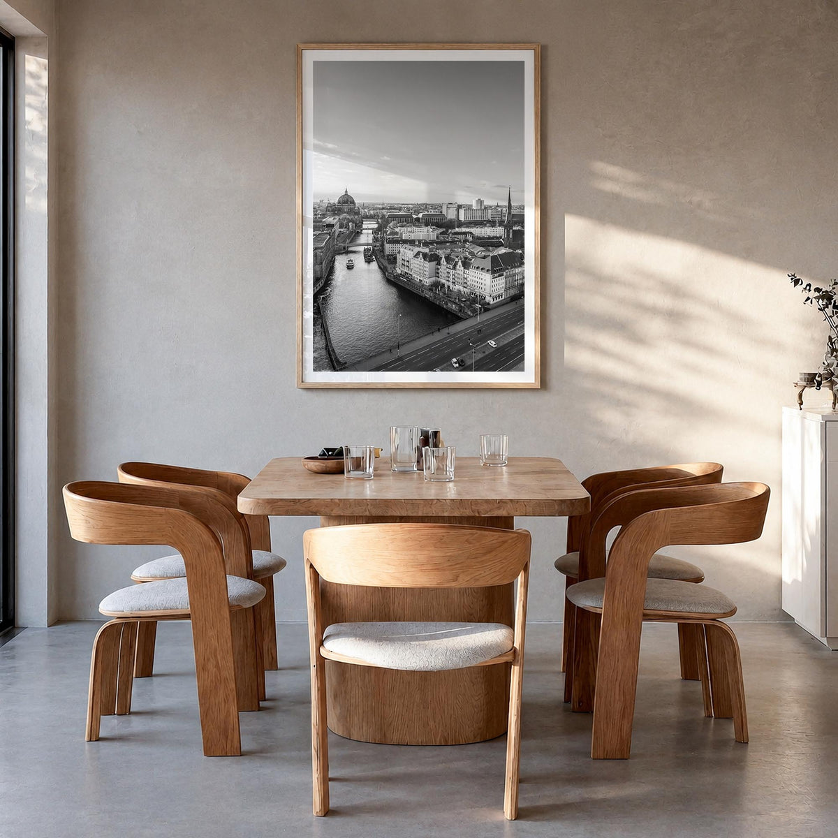 Berlin no. 1 black & white photo poster of Germany – vertical wall art in natural wood frame with white border, hanging on wa