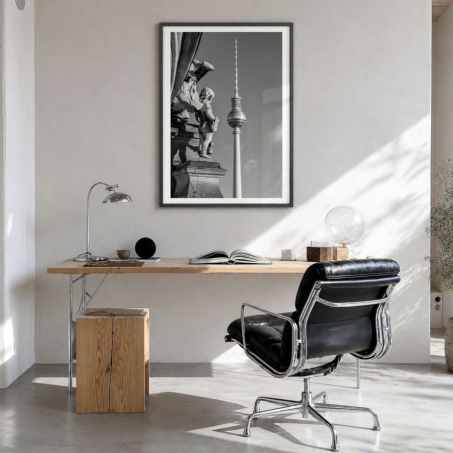 Berlin Photo No 3 Poster in a black wood frame, hanging in a bright home office, white border