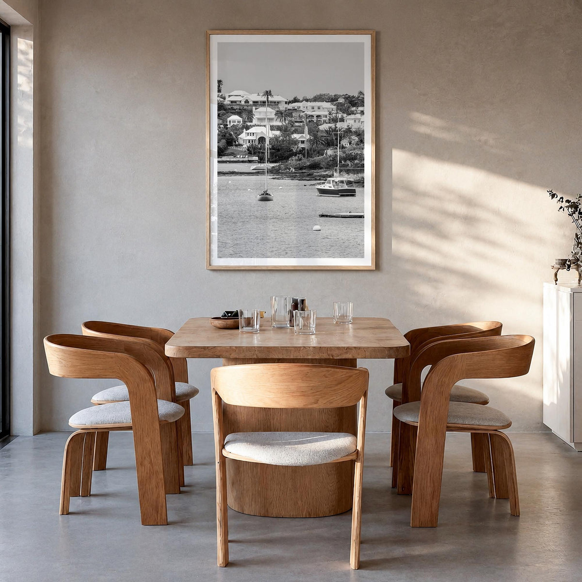 Bermuda black & white photo poster of North America – vertical wall art in natural wood frame with white border, hanging on w