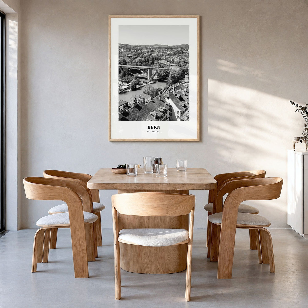 Bern Classic Poster in a natural wood frame, hanging in a dining room