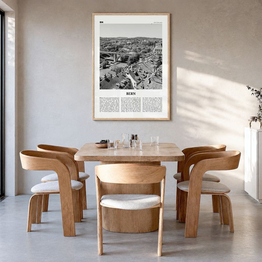 Bern Newspaper Poster in a natural wood frame, hanging in a dining room