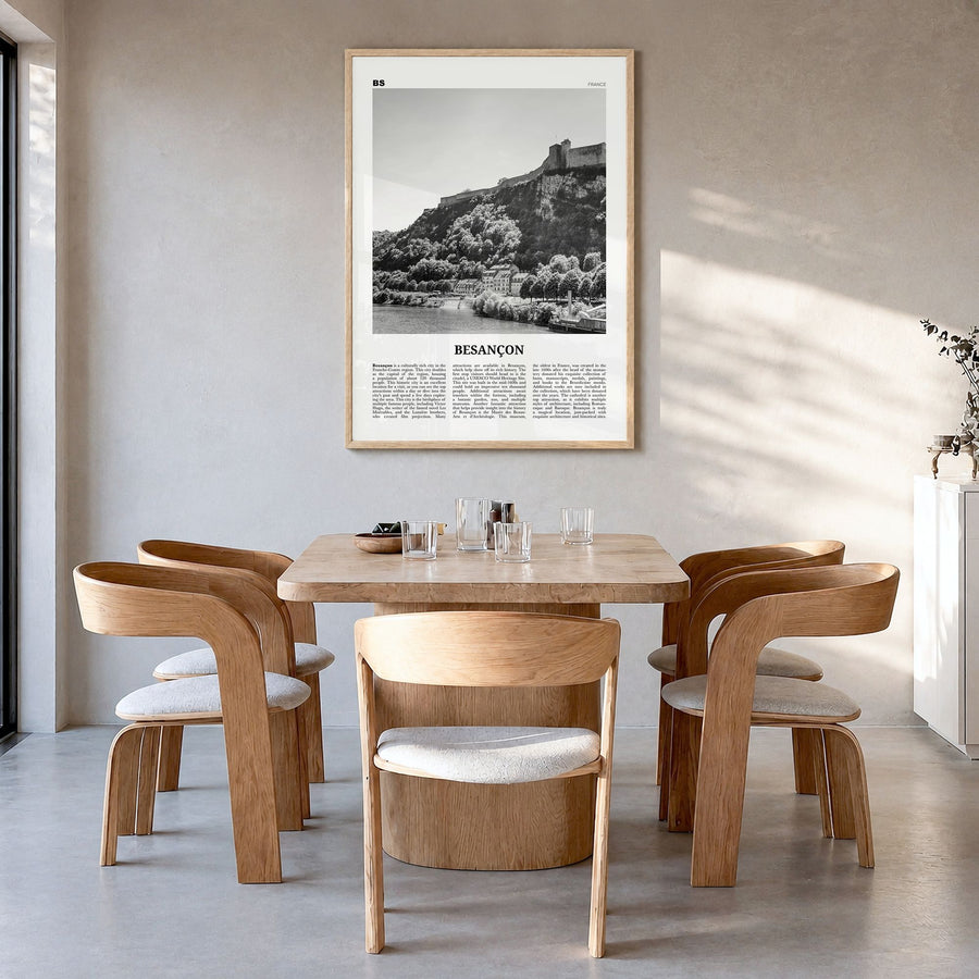 Besançon Newspaper Poster in a natural wood frame, hanging in a dining room