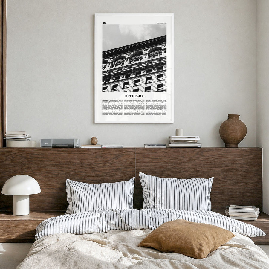 Bethesda Newspaper Poster in a white wood frame, hanging in a bedroom
