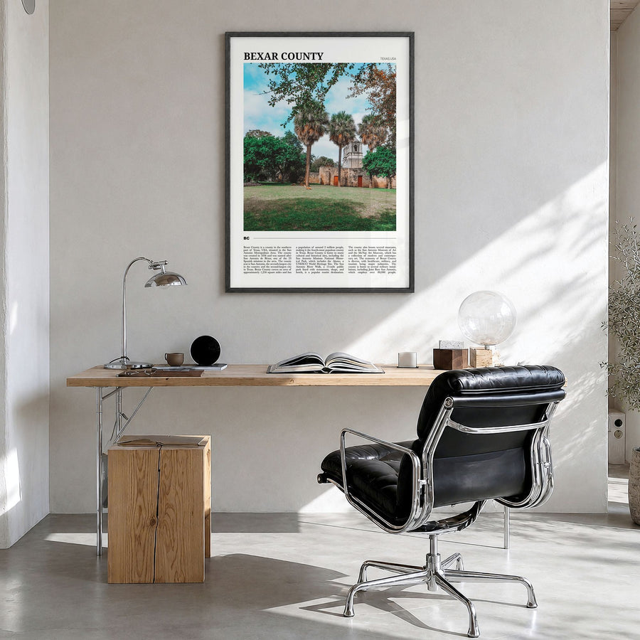 Bexar County Travel Poster in a black wood frame, hanging in a bright home office