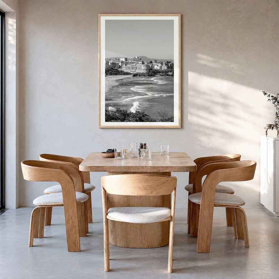 Biarritz Photo Poster in a natural wood frame, hanging in a dining room, white border