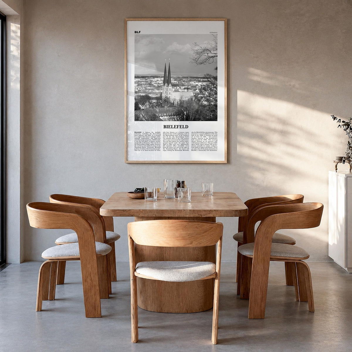 Bielefeld black & white newspaper poster of Germany – vertical wall art in natural wood frame, hanging on wall