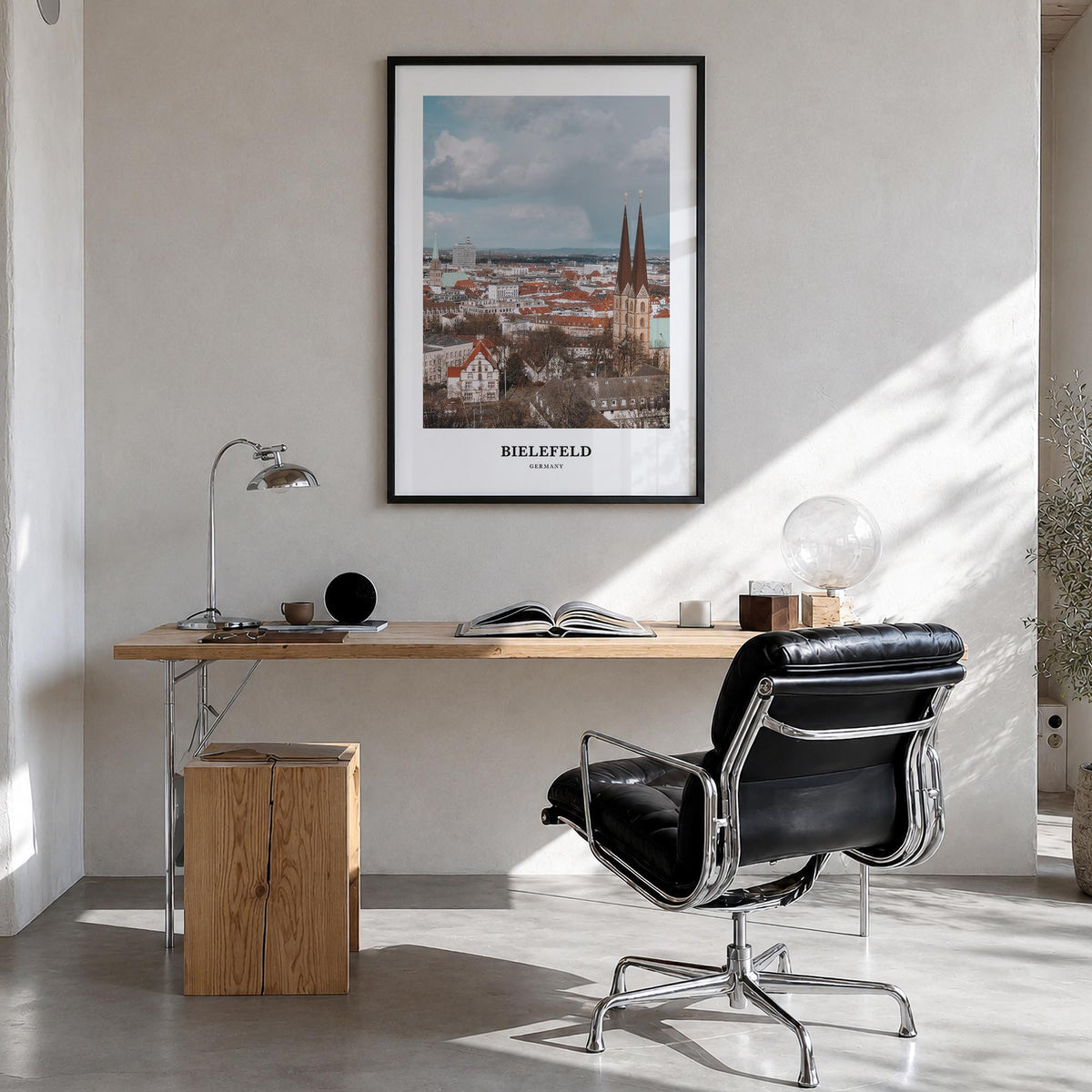Bielefeld colorful classic poster of Germany – vertical wall art in black wood frame, hanging on wall