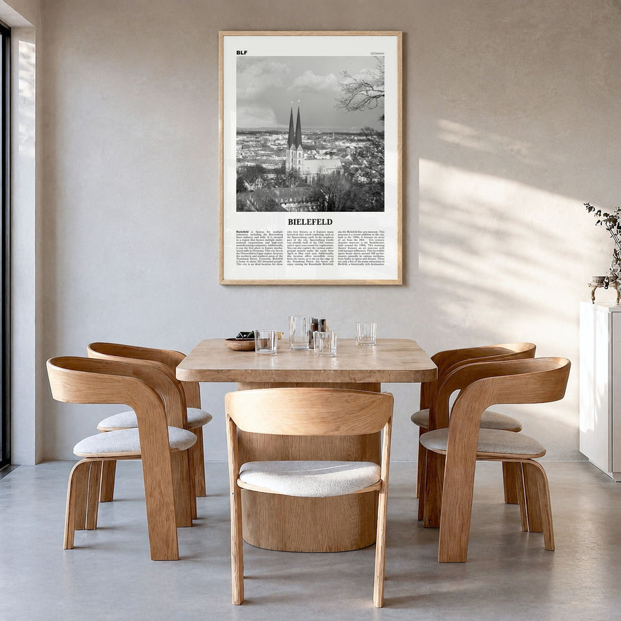 Bielefeld Newspaper Poster in a natural wood frame, hanging in a dining room