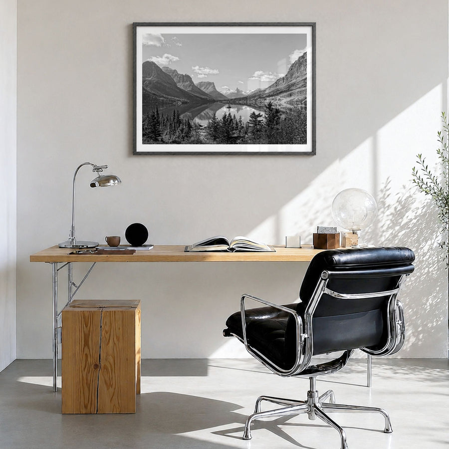 Big Sky Photo Poster in a black wood frame, hanging in a bright home office, white border
