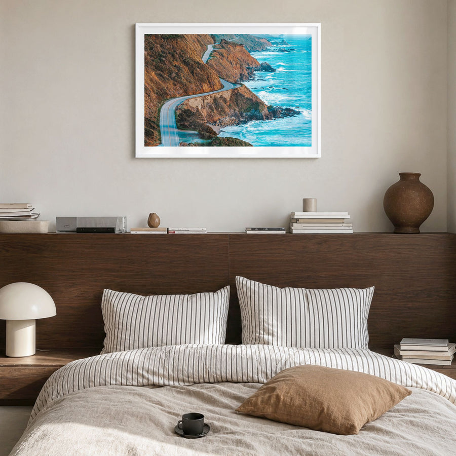 Big Sur Photo Poster in a white wood frame, hanging in a bedroom, white border
