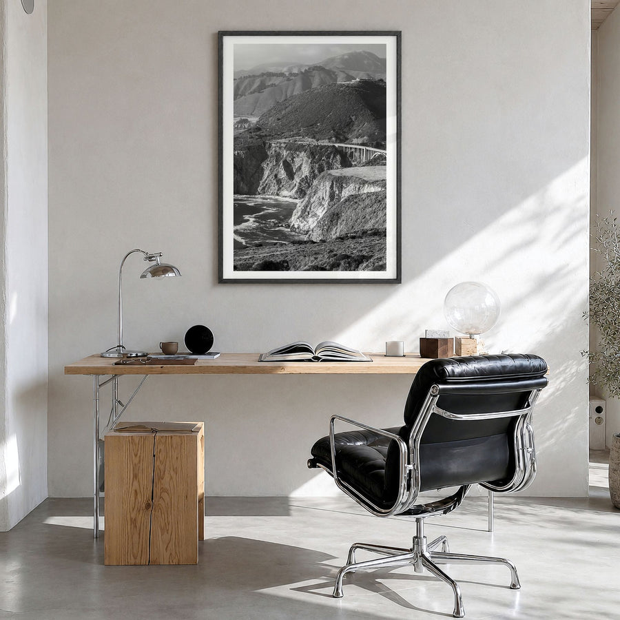 Big Sur Photo No 1 Poster in a black wood frame, hanging in a bright home office, white border