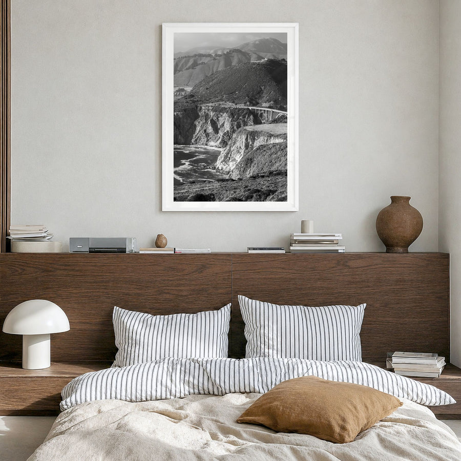 Big Sur Photo No 1 Poster in a white wood frame, hanging in a bedroom, white border