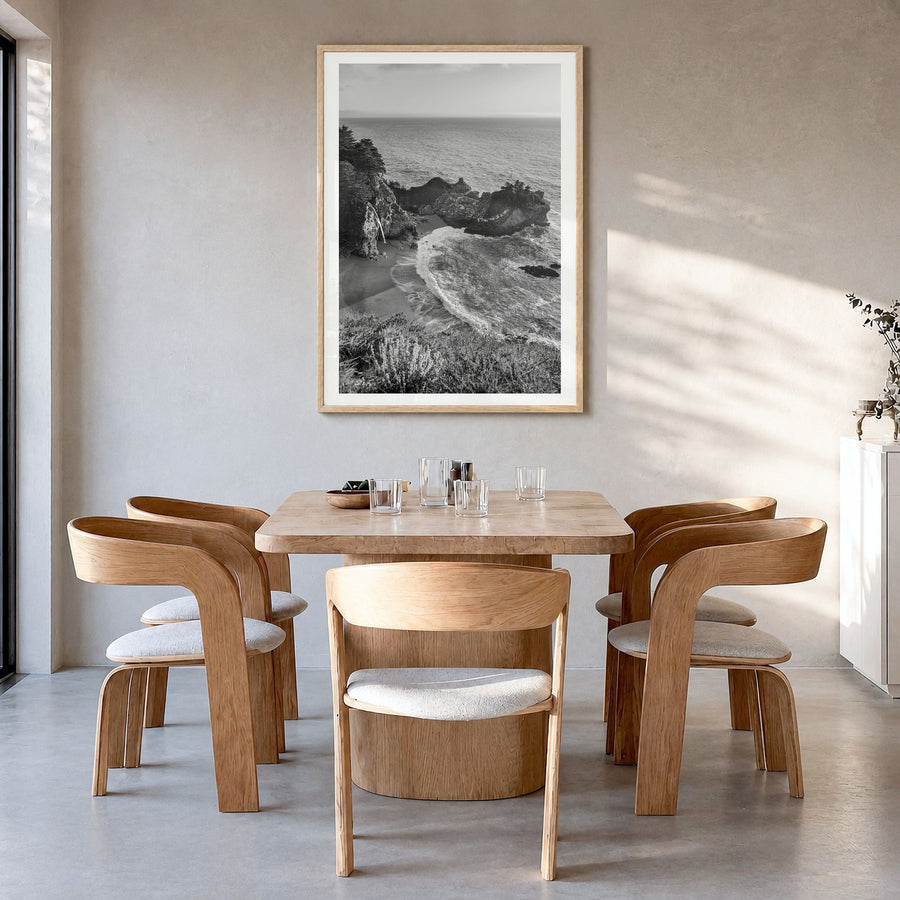 Big Sur Photo No 2 Poster in a natural wood frame, hanging in a dining room, white border