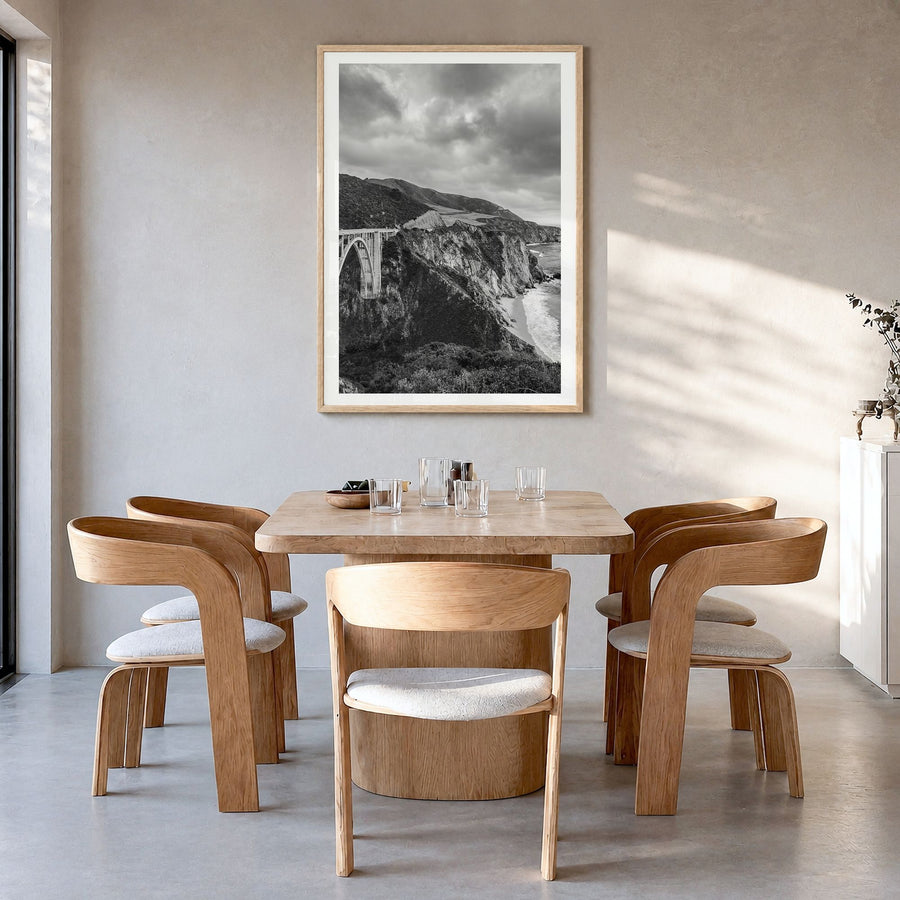 Big Sur Photo No 3 Poster in a natural wood frame, hanging in a dining room, white border
